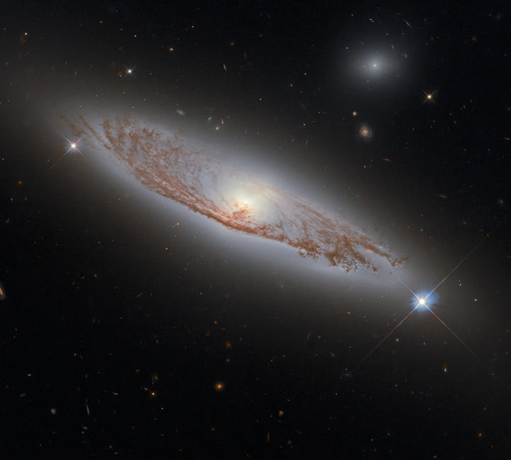 This image shows the spiral galaxy NGC 5037, in the constellation of Virgo. First documented by William Herschel in 1785, the galaxy lies about 150 million light-years away from Earth. Despite this distance, we can see the delicate structures of gas and dust within the galaxy in extraordinary detail. This detail is possible using Hubble’s Wide Field Camera 3 (WFC3), whose combined exposures created this image.