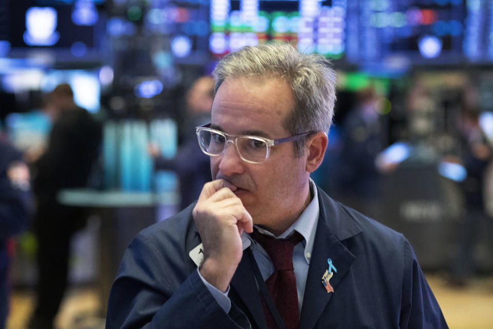 FILE - In this Tuesday, March 17, 2020, file photo, a trader works the floor at the New York Stock Exchange, in New York. The central question gripping Wall Street in spring 2021 is whether the burst of inflation hitting the economy as it recovers from the pandemic is just temporary or the start of a real problem. (AP Photo/Mark Lennihan, File)