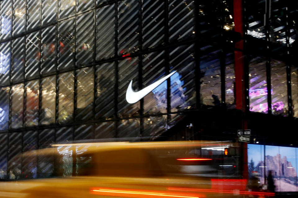 NEW YORK, NEW YORK - FEBRUARY 22: A Taxi crosses in front of the Nike store on February 22, 2021 in New York City. NIKE, Inc. (NYSE: NKE) will trade ex-dividend in the next days as NIKE's earnings have been almost flat over the past five years. (Photo by John Smith/VIEWpress via Getty Images)