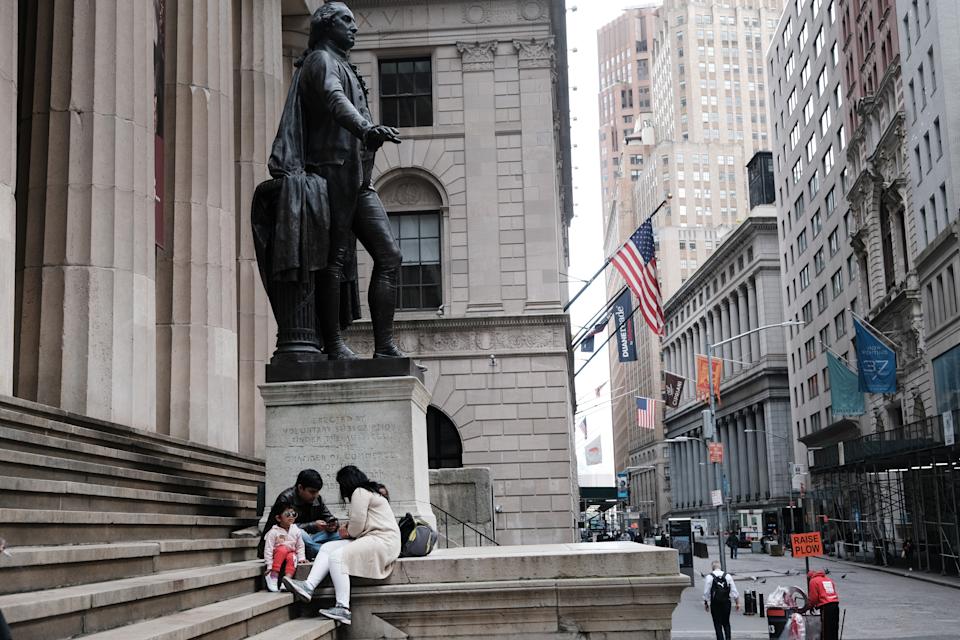 NEW YORK, NEW YORK - MAY 11: A family eats beside the New York Stock Exchange in lower Manhattan after global stocks fell as concerns mount that rising inflation will prompt central banks to tighten monetary policy on May 11, 2021 in New York City. By mid afternoon the tech-heavy Nasdaq Composite had lost 0.6% after falling 2.2% at its session low. (Photo by Spencer Platt/Getty Images)