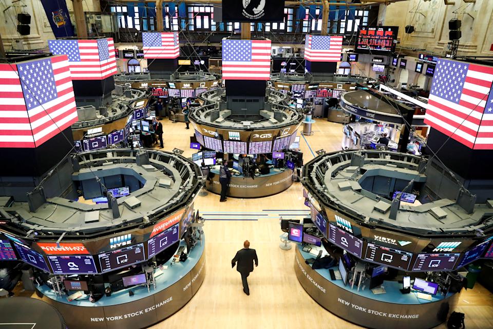 Traders work on the floor of the New York Stock Exchange shortly as coronavirus disease (COVID-19) cases in the city of New York rise, in New York, U.S., March 16, 2020. REUTERS/Lucas Jackson TPX IMAGES OF THE DAY